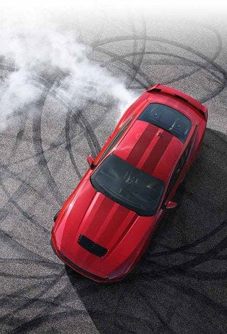 Overhead view of a 2024 Ford Mustang® model with tire tracks on pavement | Scott Ford in Kingwood WV