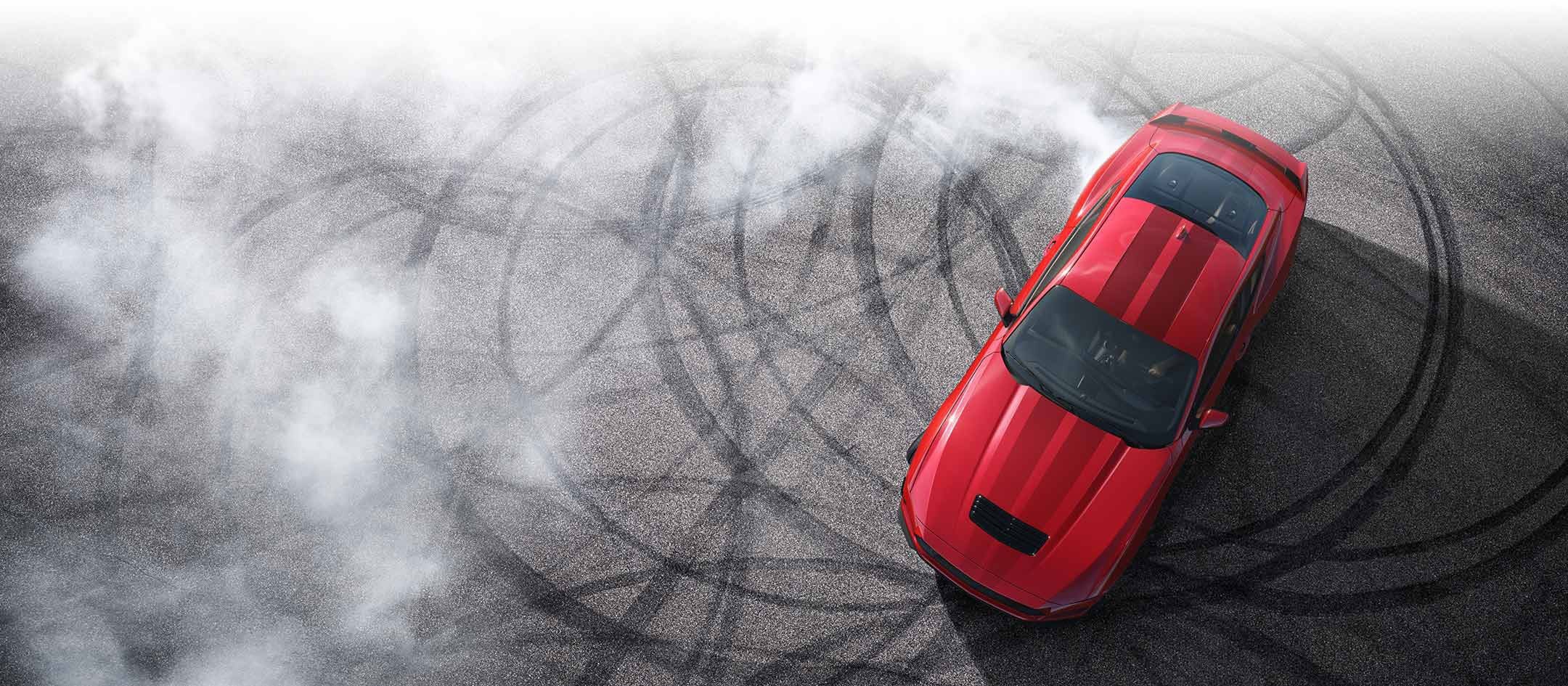 Overhead view of a 2024 Ford Mustang® model with tire tracks on pavement | Scott Ford in Kingwood WV