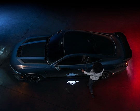 2024 Ford Mustang® Dark Horse™ model with a driver approaching the vehicle | Scott Ford in Kingwood WV