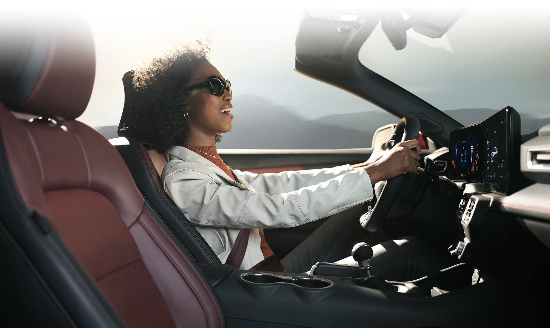 Person sitting in the driver’s seat of a 2024 Ford Mustang® convertible | Scott Ford in Kingwood WV