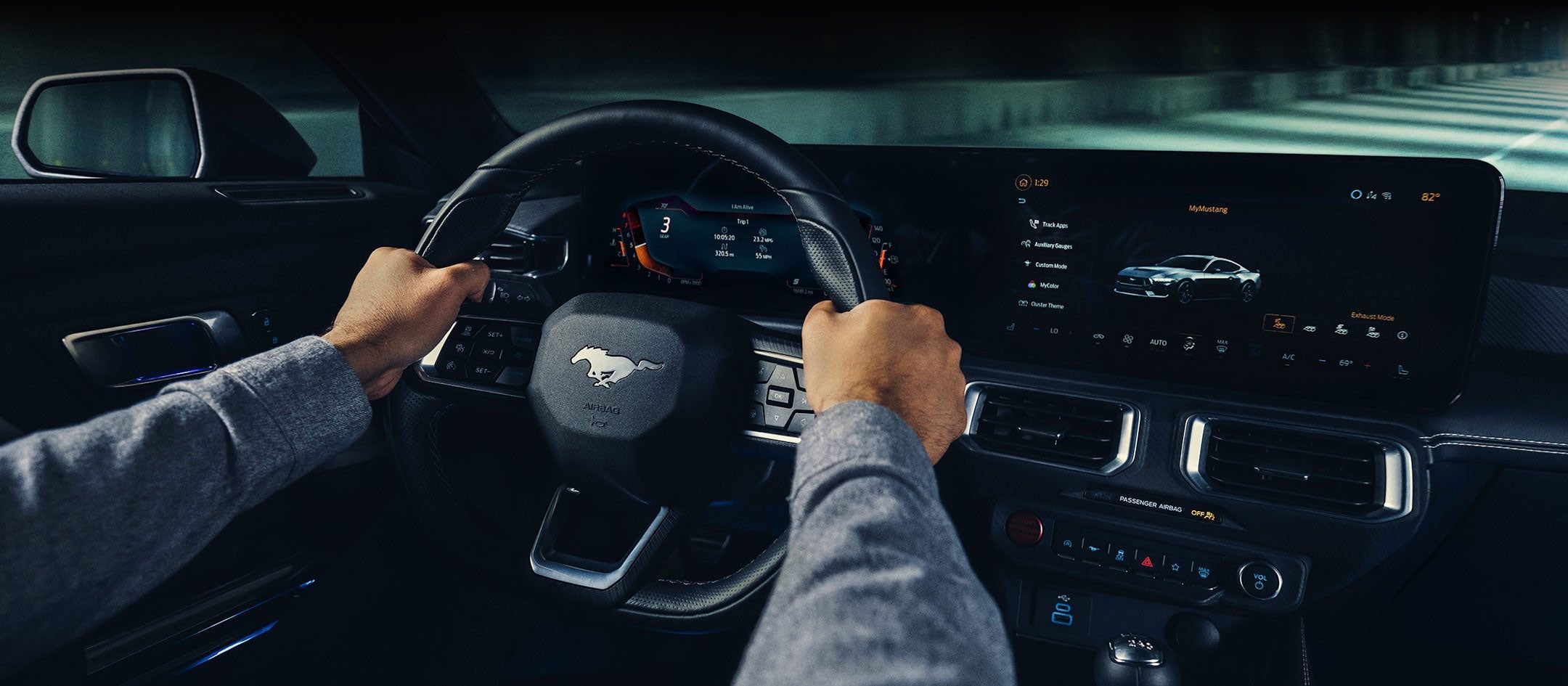 A 2024 Ford Mustang® model interior with a person driving | Scott Ford in Kingwood WV